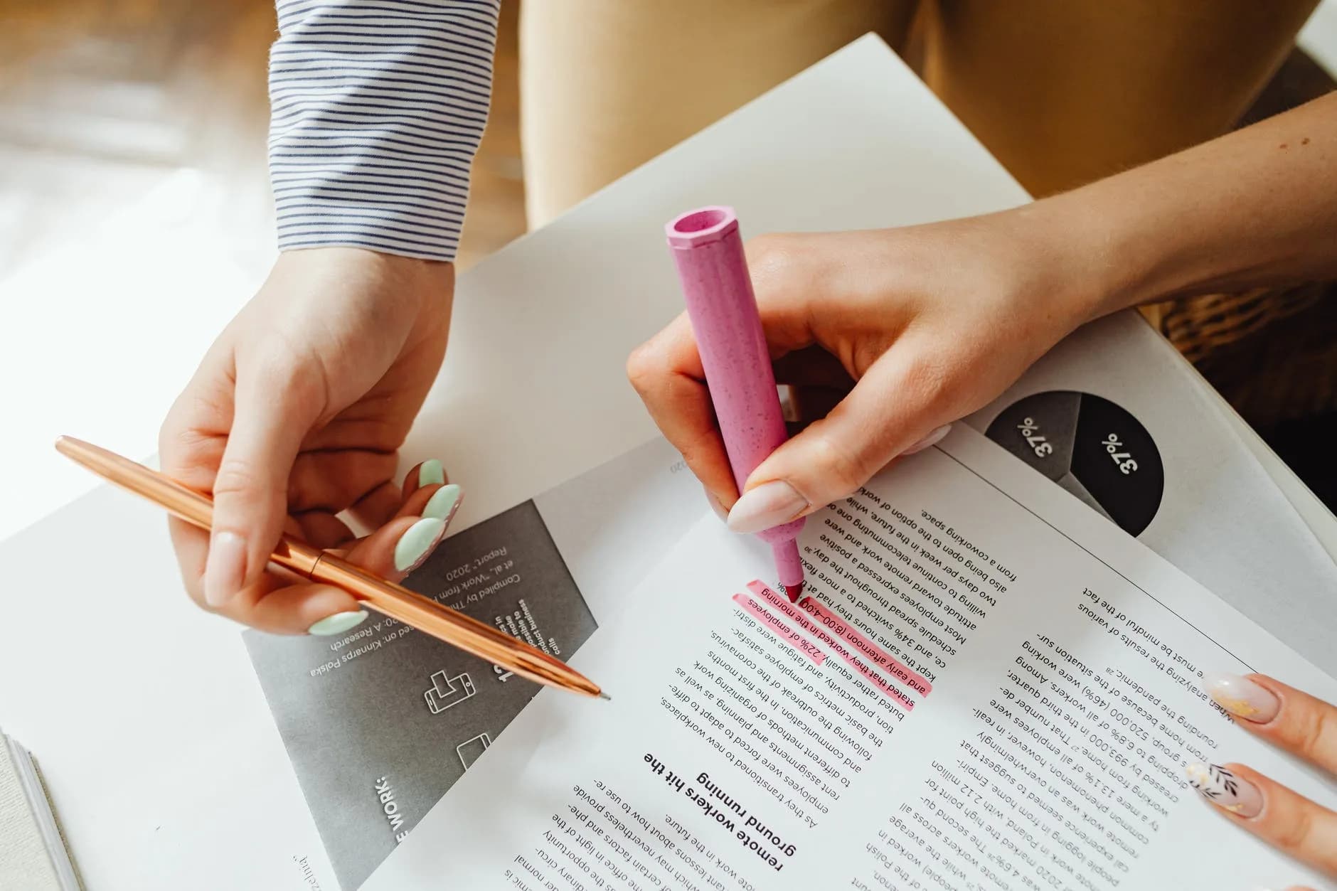 close up photo of a person using a pink highlighter