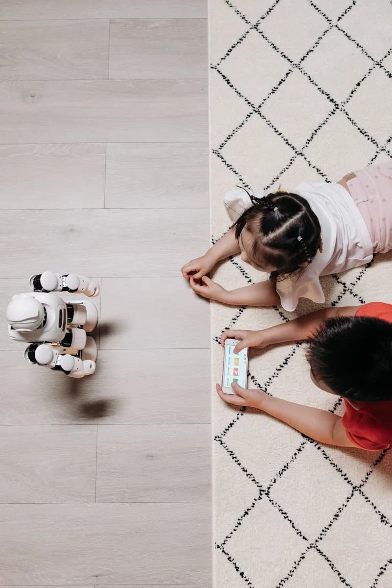 Two children interacting with a robot and smartphone on a carpet, showcasing modern technology playtime. IA, intelligence artificelle, jouets